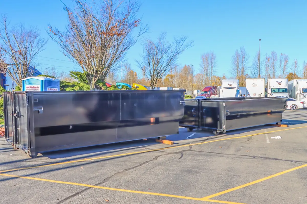 Professional dumpster rental service with roll-off container on residential driveway in Amarillo